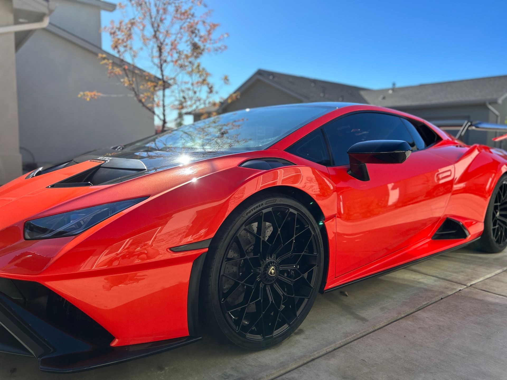 Red Lamborghini Parked in Driveway after being detailed by Eagle Star Detail